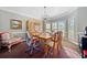 Bright dining room featuring a wooden table, chandelier, and comfortable seating at 110 Pro Ter, Johns Creek, GA 30097