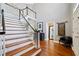 Elegant staircase with white railings and hardwood steps at 110 Pro Ter, Johns Creek, GA 30097