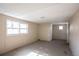 Spacious bedroom with wood paneling and large windows at 190 Highland Blvd, Stockbridge, GA 30281