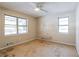 Bedroom with ceiling fan, wood flooring, and two windows at 190 Highland Blvd, Stockbridge, GA 30281