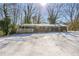 Brick ranch house with covered porch, carport, and snow-covered yard at 190 Highland Blvd, Stockbridge, GA 30281