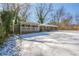 Ranch house with covered porch, carport, and snow covered yard at 190 Highland Blvd, Stockbridge, GA 30281