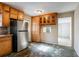 Kitchen with wood cabinets, stainless steel appliances, and tiled countertops at 190 Highland Blvd, Stockbridge, GA 30281