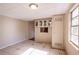 Small kitchen with white cabinets and a pass-through window at 190 Highland Blvd, Stockbridge, GA 30281