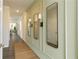 Entry hall with light walls, mirrors, and sconce lighting at 2639 Cacao Sq, Acworth, GA 30101