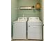 Laundry room with washer, dryer, and a shelf for linens at 2639 Cacao Sq, Acworth, GA 30101