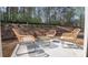 Relaxing patio with wicker furniture and view of wooded backyard at 2639 Cacao Sq, Acworth, GA 30101