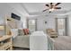 Bright bedroom with a ceiling fan and large bed at 555 Winder Trl, Canton, GA 30114