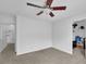 Upstairs bedroom with ceiling fan and walk-in closet at 555 Winder Trl, Canton, GA 30114