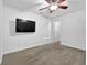 Bedroom with wall-mounted TV and ceiling fan at 555 Winder Trl, Canton, GA 30114