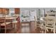 Kitchen dining area with hardwood floors and white chairs at 555 Winder Trl, Canton, GA 30114