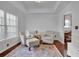 Cozy living room with hardwood floors, two armchairs, and an area rug at 555 Winder Trl, Canton, GA 30114