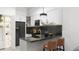 Modern kitchen with dark cabinetry, quartz countertops, and breakfast bar at 6305 Shannon Pkwy # 203, Union City, GA 30291