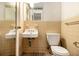 Small bathroom with a toilet and sink at 1491 Boulderwoods Se Dr, Atlanta, GA 30316