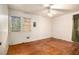 Simple bedroom with hardwood floors and ceiling fan at 1491 Boulderwoods Se Dr, Atlanta, GA 30316