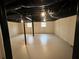Unfinished basement with white painted walls and windows at 1938 Highway 212 Sw, Conyers, GA 30094