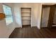 Bright storage closet with adjustable shelves and a wood floor at 1938 Highway 212 Sw, Conyers, GA 30094