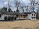 Attractive exterior view of home featuring a combination of brick and siding at 1938 Highway 212 Sw, Conyers, GA 30094