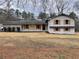 Charming home with brick accents, wooden shutters, and a well-manicured lawn at 1938 Highway 212 Sw, Conyers, GA 30094