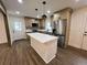 Modern kitchen featuring a large island, stainless steel appliances, and granite countertops at 1938 Highway 212 Sw, Conyers, GA 30094
