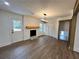 Living room with brick fireplace and doors leading outside at 1938 Highway 212 Sw, Conyers, GA 30094