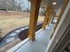 Inviting covered porch featuring natural wood pillars and a stone pathway at 1938 Highway 212 Sw, Conyers, GA 30094