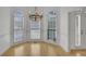 Formal dining room with hardwood floors and chandelier at 200 Holly Chase Ct, Canton, GA 30114