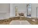 Granite countertops, stainless steel appliances, and a view into the dining area at 200 Holly Chase Ct, Canton, GA 30114