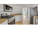 Modern kitchen with stainless steel appliances and white cabinetry at 200 Holly Chase Ct, Canton, GA 30114