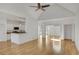 Open concept living room with kitchen and hardwood floors at 200 Holly Chase Ct, Canton, GA 30114