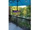 Outdoor balcony with TV and umbrella, overlooking a pond at 3812 Stonewall Se Ter, Atlanta, GA 30339