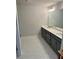 Bathroom featuring double sinks, granite countertop, grey cabinets and marble floors at 3990 Cavalier Way, Duluth, GA 30097