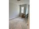 Bright bedroom with carpet, a window, and space for a desk, perfect for relaxation and study at 3990 Cavalier Way, Duluth, GA 30097
