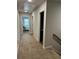 Upstairs hallway with carpet and white trim leads to bedrooms and bathrooms at 3990 Cavalier Way, Duluth, GA 30097
