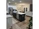 Modern kitchen with stainless steel appliances, granite countertops, and an island with seating at 3990 Cavalier Way, Duluth, GA 30097