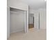 Good-sized basement closet with built-in shelving and access to another room at 5966 Rosie Se Ln, Mableton, GA 30126