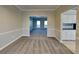 Dining room with neutral decor and views of kitchen and living room at 1019 Braelin Ct, Woodstock, GA 30189