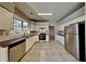 Kitchen with white cabinets, stainless steel appliances, and tile floor at 1019 Braelin Ct, Woodstock, GA 30189