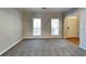 Living area with neutral walls, carpeting, and view of entry at 1019 Braelin Ct, Woodstock, GA 30189