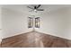 Spacious bedroom with wood floors and a ceiling fan at 3920 Stone Creek Cir, Cumming, GA 30041