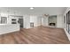 Open concept living room with kitchen island and fireplace at 3920 Stone Creek Cir, Cumming, GA 30041