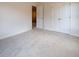 Bedroom with carpet, double doors to closet and access to loft at 7179 Linden Dr, South Fulton, GA 30349