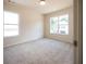 Bright bedroom with neutral carpeting and large windows at 7179 Linden Dr, South Fulton, GA 30349