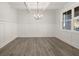 Spacious dining room with chandelier and wainscoting at 7179 Linden Dr, South Fulton, GA 30349