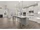 Modern kitchen with gray island and stainless steel appliances at 7179 Linden Dr, South Fulton, GA 30349