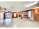 Spacious basement recreation area with wood paneling and fireplace at 882 Edgewater Trl, Atlanta, GA 30328