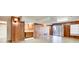 Unfinished basement with wood paneling and access to patio at 882 Edgewater Trl, Atlanta, GA 30328