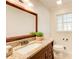 Bathroom boasts granite countertops and a large vanity mirror at 882 Edgewater Trl, Atlanta, GA 30328