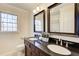 Bathroom boasts double vanity with granite countertop at 882 Edgewater Trl, Atlanta, GA 30328