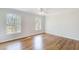 Hardwood floor bedroom with two windows and ceiling fan at 882 Edgewater Trl, Atlanta, GA 30328